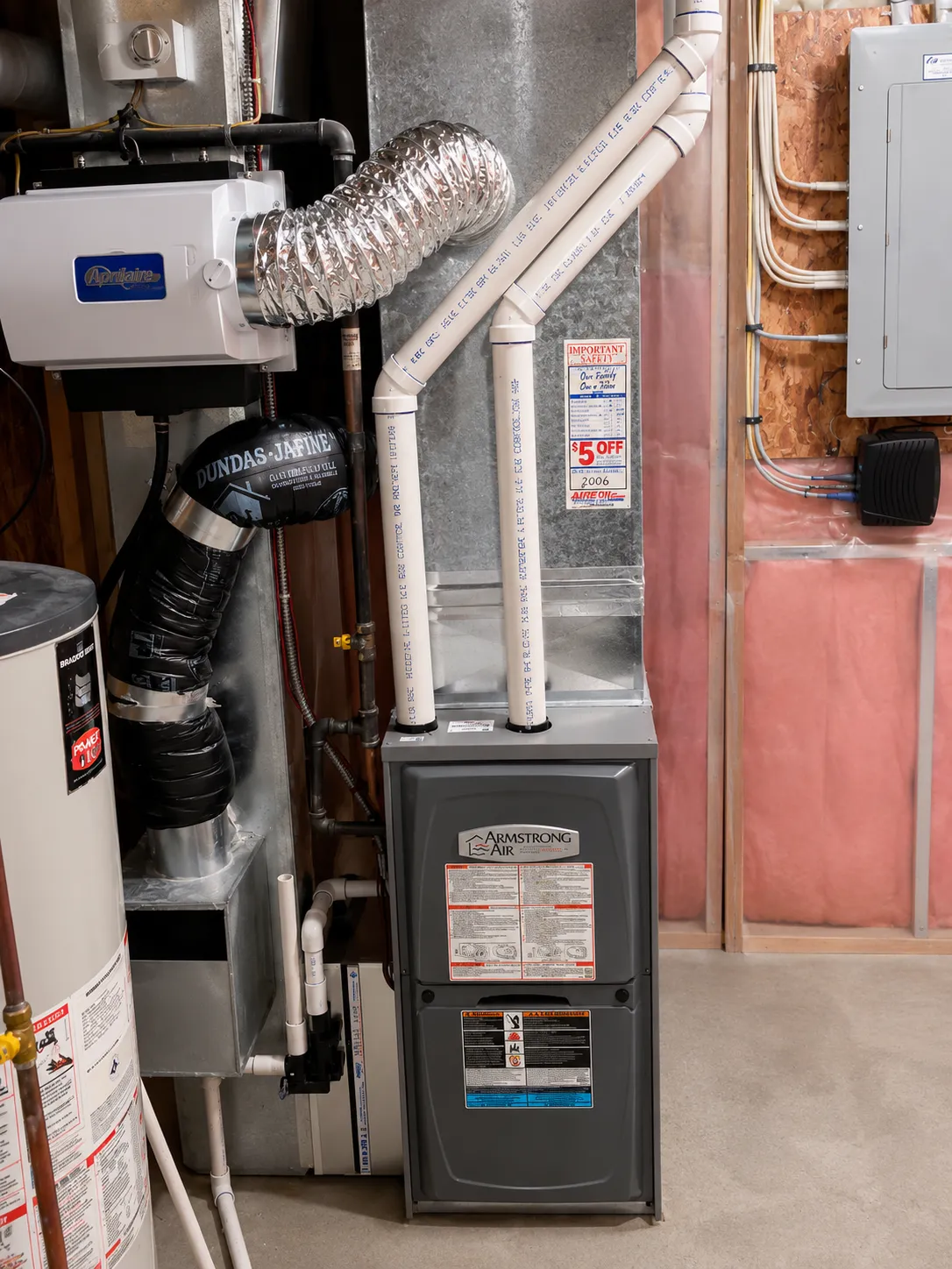 City Furnace journeyman installing a high-efficiency furnace in a greater Edmonton area home